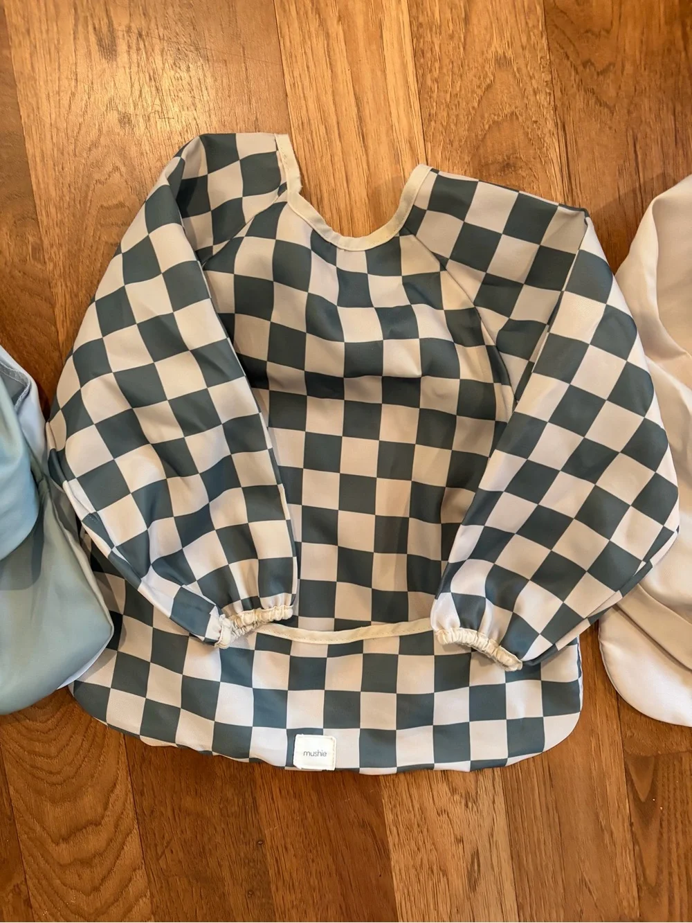 Like New Mushie Long Sleeve Baby Bibs - Teal, Checkerboard, Cream